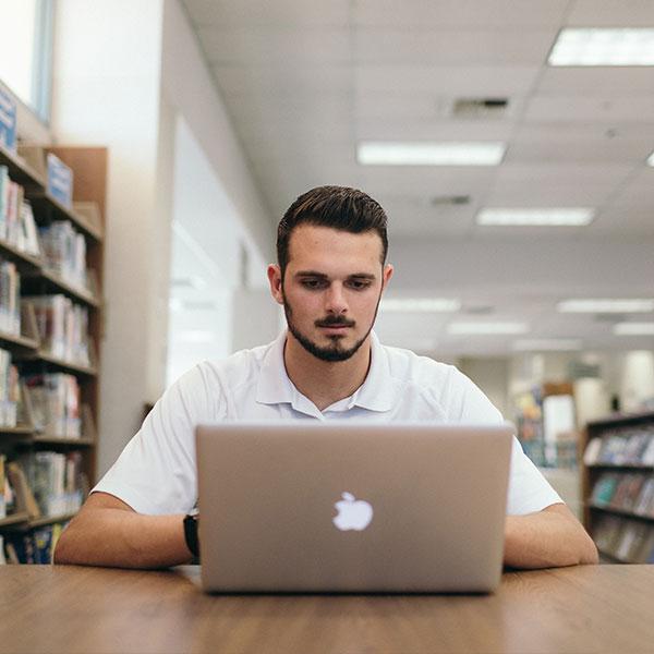 Male student on a computer